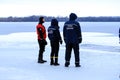 Rescuers in uniform and diving suit are on duty on the frozen river during winter fishing and sport events. Rescue service