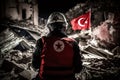 Rescuers in uniform and helmets dismantle the rubble of houses after the earthquake, the ruined city and multi-storey