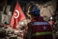 Rescuers in uniform and helmets dismantle the rubble of houses after the earthquake, the ruined city and multi-storey