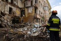 Rescuers work in building destroyed by Russian missile searching for bodies