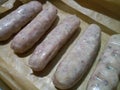 Raw British sausages on parchment paper