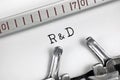 Research and development acronym R & D or R&D text macro closeup, typewriter typed new efficient innovative technological products Royalty Free Stock Photo