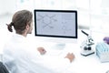 Young man working in a medical lab using a computer Royalty Free Stock Photo