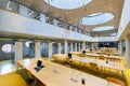 The Research Library is a public university library. Modern interior with round windows and bookshelves Beautiful an extraordinary Royalty Free Stock Photo