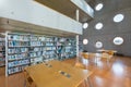 The Research Library is a public university library. Modern interior with round windows and bookshelves Beautiful an extraordinary