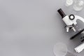 Research with microscope. Laboratory backround with blood sample on grey table top view copy space Royalty Free Stock Photo