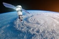 Research, probing, monitoring hurricane Florence raging on the coast. Satellite above the Earth makes measurements of the weather