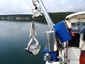 Research winch recovering benthic grab with sample from the sea bottom