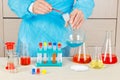 Researcher is conducting chemical experiments in laboratory