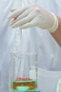 Researcher doing the experiment, titration of the reagent in the