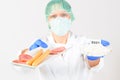 Researcher with food and preservatives Royalty Free Stock Photo