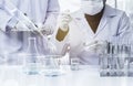 Researcher with glass laboratory chemical test tubes with liquid for analytical , medical, pharmaceutical and scientific research Royalty Free Stock Photo