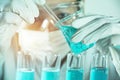 Researcher with glass laboratory chemical test tubes with liquid Royalty Free Stock Photo