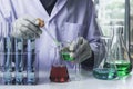 Researcher with glass laboratory chemical test tubes with liquid for analytical , medical, pharmaceutical and scientific research Royalty Free Stock Photo