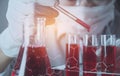 Researcher with glass laboratory chemical test tubes with liquid Royalty Free Stock Photo