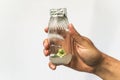 Researcher hand with test tube with cloned microplant, research bioengineering gmo concept