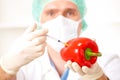 Researcher holding up a GMO vegetable in the lab Royalty Free Stock Photo