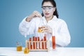 Researcher holds chemical liquid in test tube Royalty Free Stock Photo