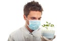 Researcher man holding new cucumber plants Royalty Free Stock Photo