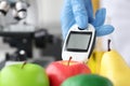 Researcher measures harmful substances in fruits closeup Royalty Free Stock Photo