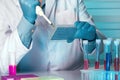 Researcher pipetting samples in micro plate Royalty Free Stock Photo