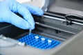 A researcher putting PCR tubes on the thermal cycler for DNA amplification Royalty Free Stock Photo