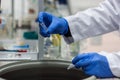 Researcher or scientist or phd student working in a biotechnology laboratory sampling DNA in a test tube with centrifuge Royalty Free Stock Photo