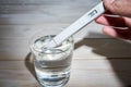 A researcher uses a electric water tester to test the electrical conductivity, TDS, and salt content of a water