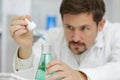 Researcher at work in laboratory with blood pipette