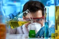 Researcher working mixing fluids in the biochemistry laboratory