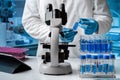 Researcher working with samples and microscope in the research laboratory Royalty Free Stock Photo