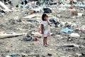RESEN, MACEDONIA - JULY 23 : Unidentified child is holding magazine paper in a garbage dump