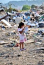 RESEN, MACEDONIA - JULY 23 : Unidentified child is looking at magazine paper in a garbage dump