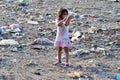 RESEN, MACEDONIA - JULY 23 : Unidentified child is looking at magazine paper in a garbage dump