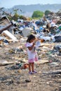 RESEN, MACEDONIA - JULY 23 : Unidentified child is looking at magazine paper in a garbage dump