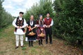 RESEN, MACEDONIA. 27 SEPTEMBER 2020- Boys and girls in traditional clothes posing with apples during festival Prespa apple picking