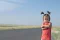 Resentful child is standing and don`t want to go anywhere defend own position . Little girl in kazakh steppe Royalty Free Stock Photo