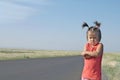 Resentful child is standing and don`t want to go anywhere defend own position . Little girl in kazakh steppe Royalty Free Stock Photo