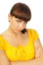 Resentful young girl in yellow dress