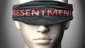 Resentment can make things harder to see or makes us blind to the reality - pictured as word Resentment on a blindfold to