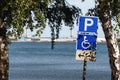 Reserved disabled parking space sign at Kattegat sea shoreline in Halmstad, Sweden Royalty Free Stock Photo