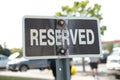 reserved horizontal rectangle black white sign on metal post with parking lot 166 p 17