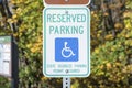 Reserved parking for a person with disability signage on a metal post at Tacoma in Washington