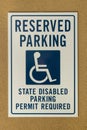 Reserved parking sign mounted on a wall Royalty Free Stock Photo