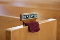 Reserved sign on church pew