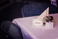 Reserved sign on restaurant table Royalty Free Stock Photo