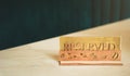 Reserved sign on restaurant table. Concept background. Gold sign. Coffee beans carved on a wood Royalty Free Stock Photo