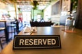 Reserved sign on restaurant table Royalty Free Stock Photo