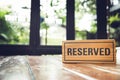 Reserved sign on a restaurant wooden table Royalty Free Stock Photo