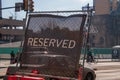 Reserved sign seen on a fence on a city street Royalty Free Stock Photo